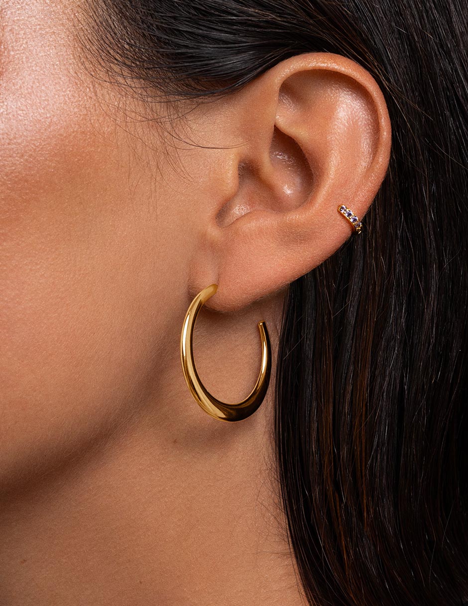 Aretes redondos con acabado baño de oro 18 K 3