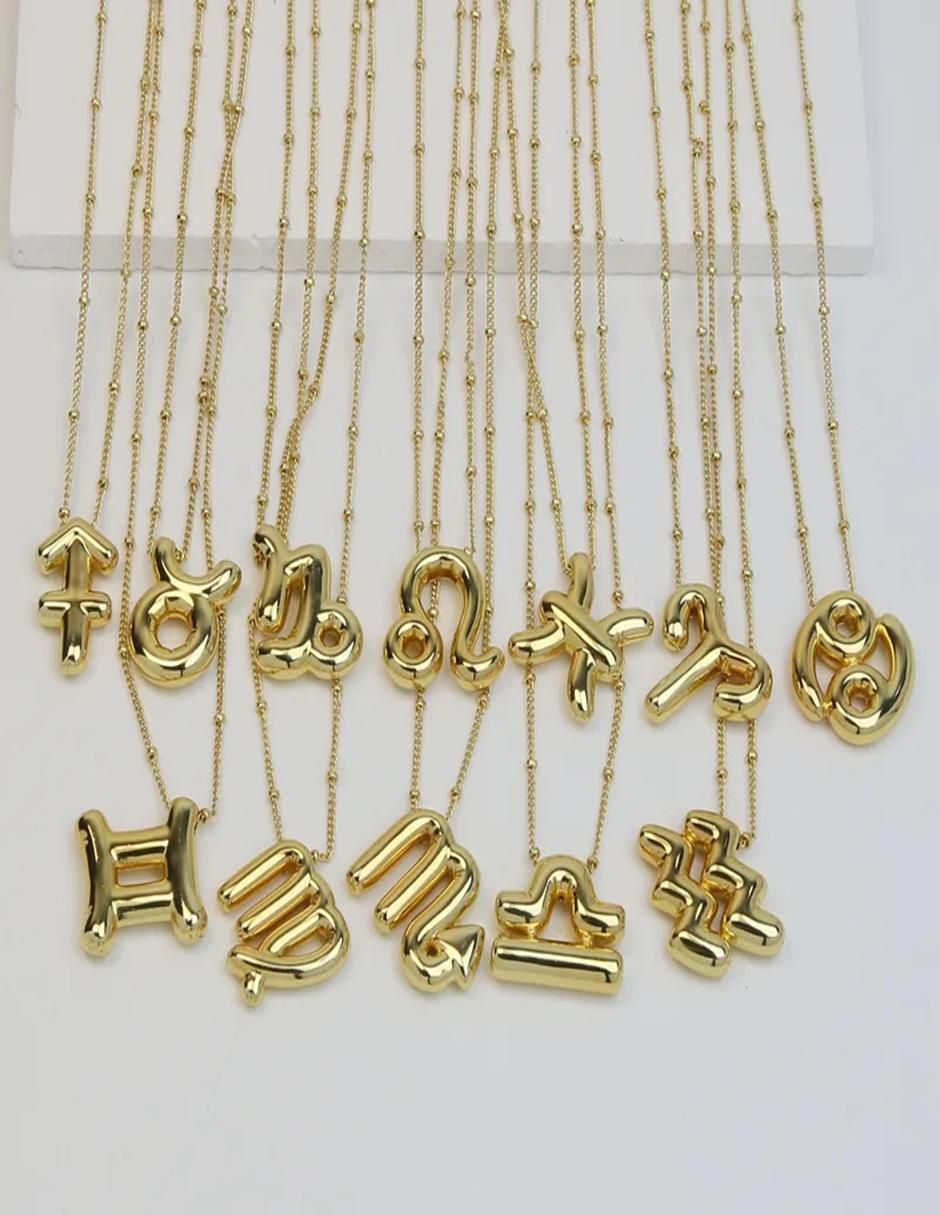 Collar con dije de signo zodiacal de oro laminado