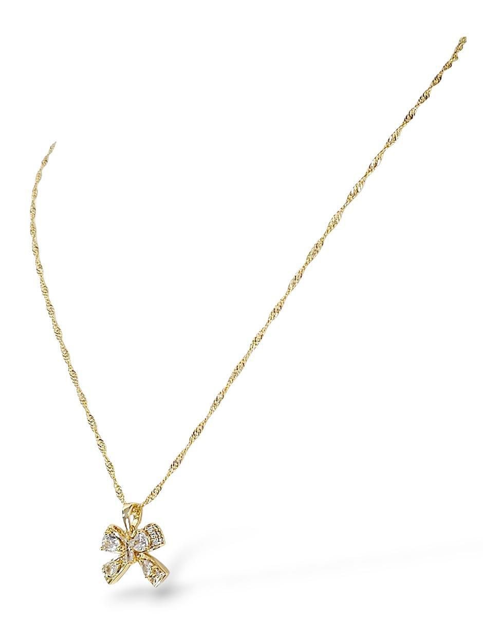 Aretes y collar de moño de oro laminado 18 k zirconia